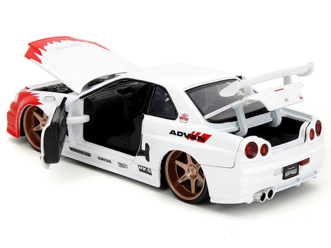 2002 Nissan Skyline GT-R (R34) RHD (Right Hand Drive) White with Red Graphics and Ryu Diecast Figure "Street Fighter" Video Game "Anime Hollywood Rides" Series 1/24 Diecast Model Car by Jada-2
