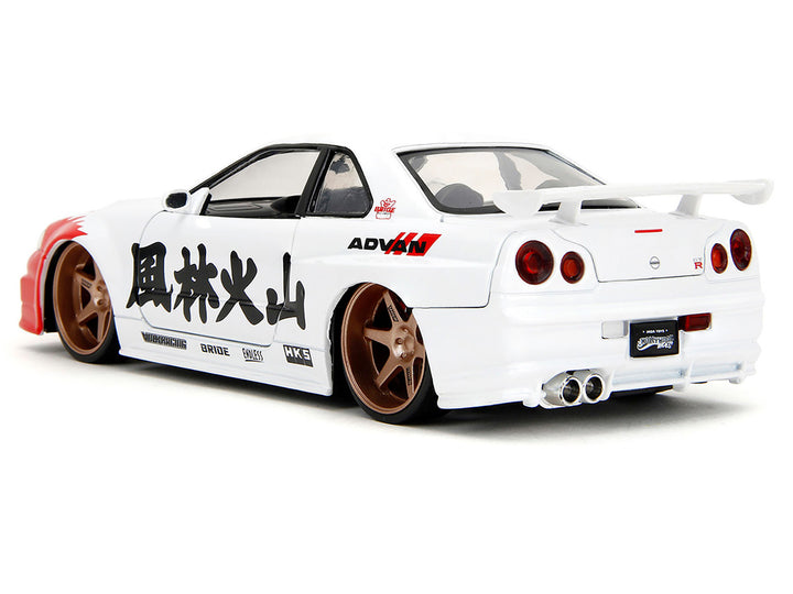 2002 Nissan Skyline GT-R (R34) RHD (Right Hand Drive) White with Red Graphics and Ryu Diecast Figure "Street Fighter" Video Game "Anime Hollywood Rides" Series 1/24 Diecast Model Car by Jada-1