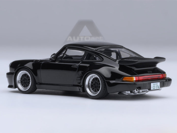 Rear three-quarter view of the Porsche 911 (930) Turbo Blackbird Black Wangan Midnight Comic #1 Version 1/64 model car by Autoart.