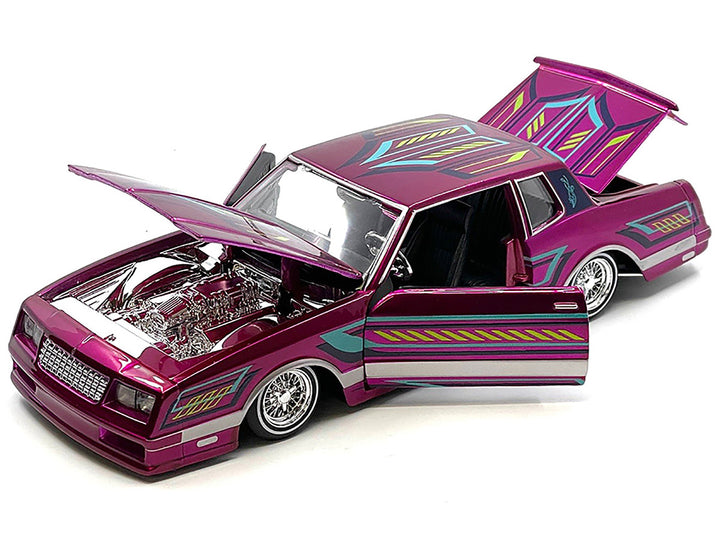 1986 Chevrolet Monte Carlo SS Lowrider Pink Metallic with Graphics "Lowriders" Series 1/24 Diecast Model Car by Maisto-1