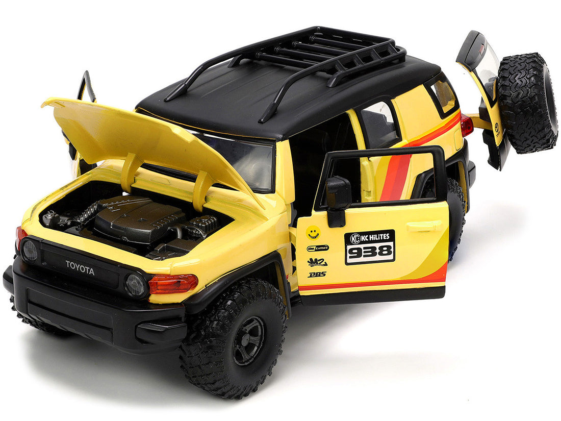 Toyota FJ Cruiser #938 Cream with Matt Black Top with Roof Rack and Stripes "KC Hilites" with Extra Wheels "Just Trucks" Series 1/24 Diecast Model Car by Jada-1