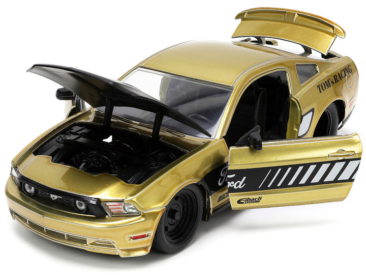 2010 Ford Mustang GT Gold Metallic with Black Graphics and Hood "Tom's Racing" "Bigtime Muscle" Series 1/24 Diecast Model Car by Jada-1