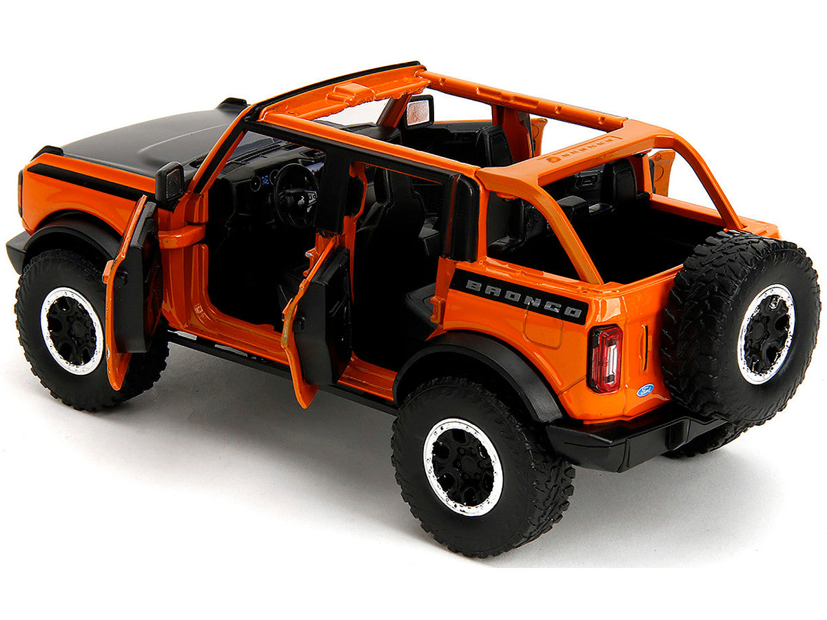 2021 Ford Bronco Open-Top Orange with Black Stripes and Hood with Extra Wheels "Just Trucks" Series 1/24 Diecast Model Car by Jada-2