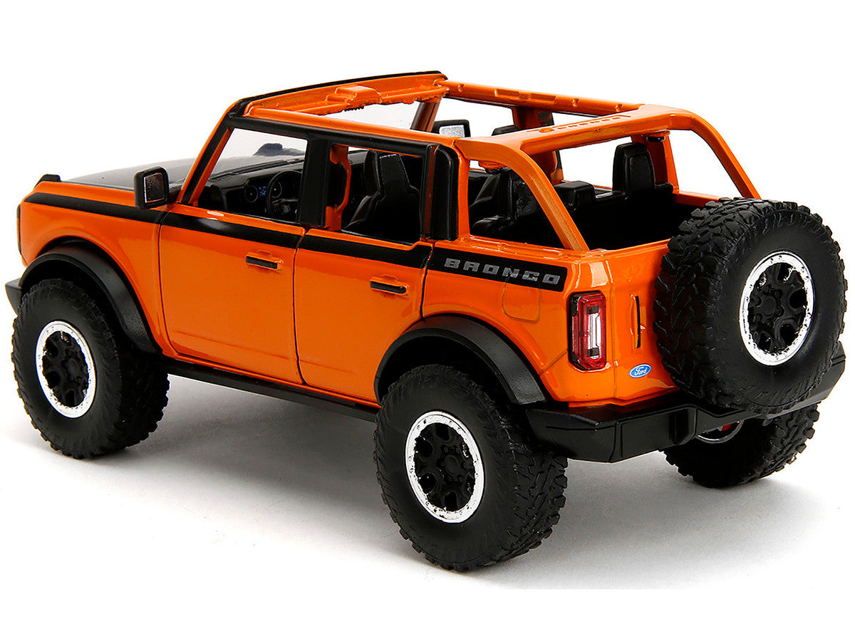 2021 Ford Bronco Open-Top Orange with Black Stripes and Hood with Extra Wheels "Just Trucks" Series 1/24 Diecast Model Car by Jada-3