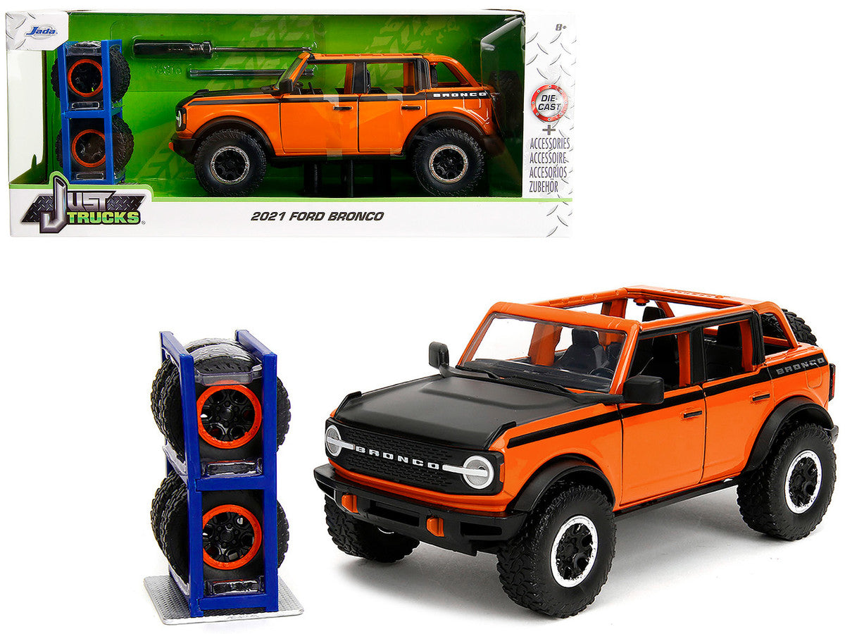 2021 Ford Bronco Open-Top Orange with Black Stripes and Hood with Extra Wheels "Just Trucks" Series 1/24 Diecast Model Car by Jada-4