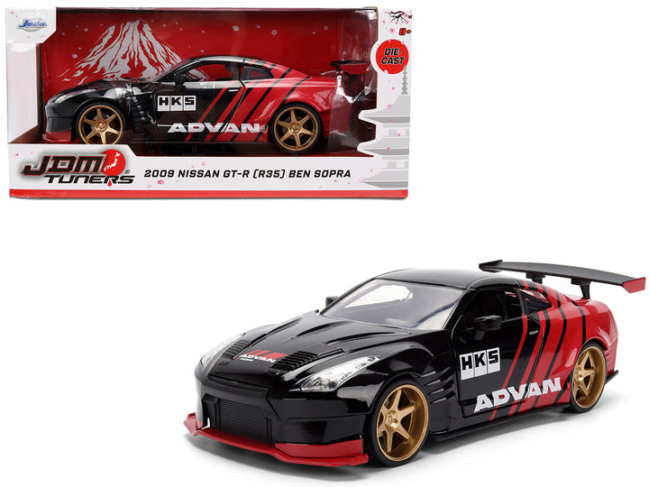 2009 Nissan GT-R R35 Ben Sopra ADVAN black and red 1/24 diecast model car by Jada in packaging view.