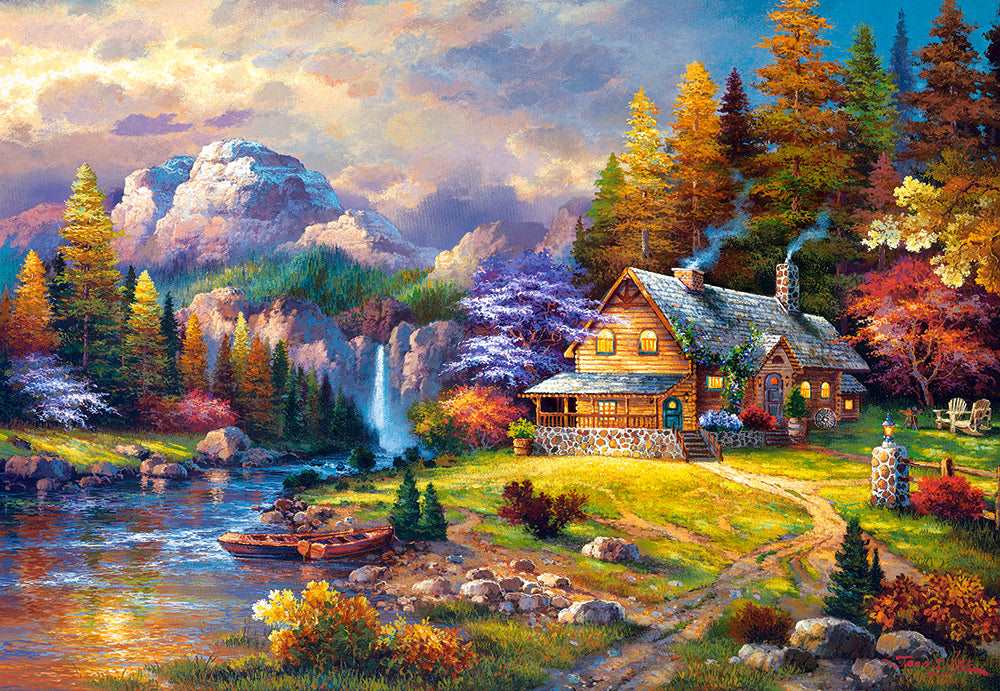 Mountain Hideaway puzzle artwork featuring cottage, water, colorful fall trees and mountains