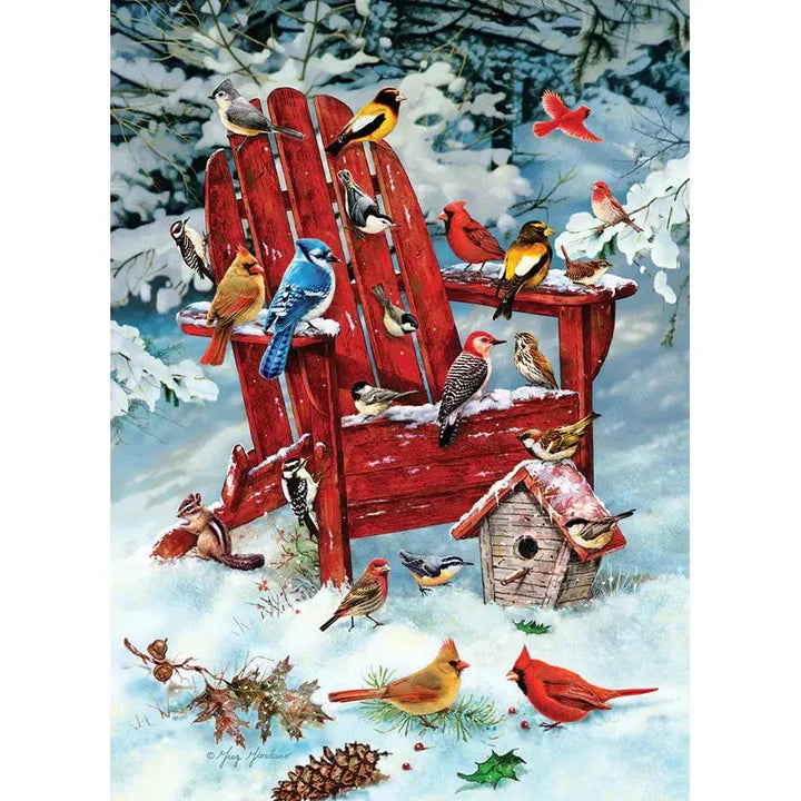 Jack Pine Adirondack Birds 1000 Piece Jigsaw Puzzle featuring colorful winter birds around a red Adirondack chair in the snow - image