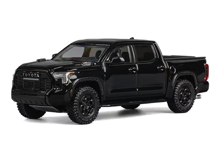 Side profile of the Toyota Tundra Pickup Truck Black 1/64 diecast model by CM Models.