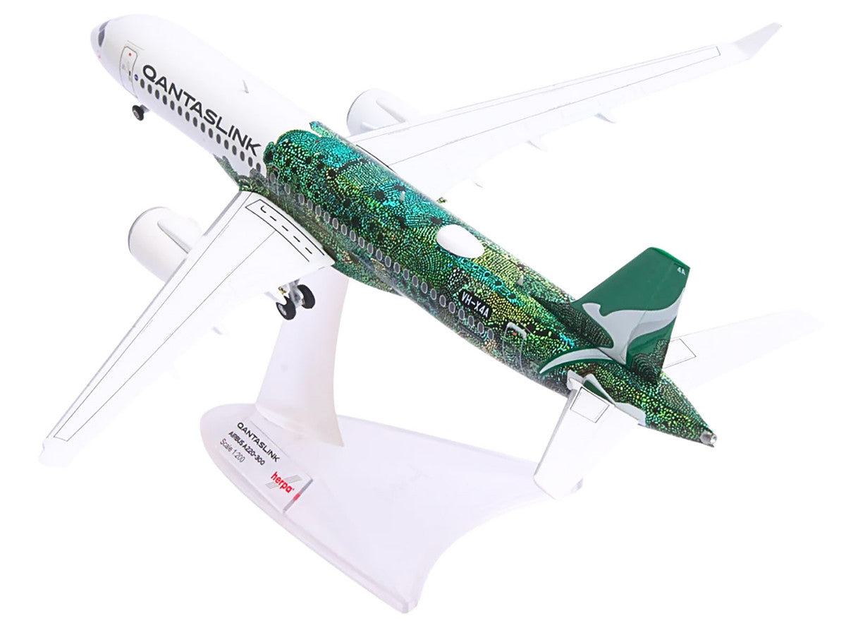 Airbus A220-300 Commercial Aircraft "QantasLink Flying Art Series - Minyma Kutjara Tjukurpa" (VH-X4A) White with Green Graphics 1/200 Diecast Model by Herpa