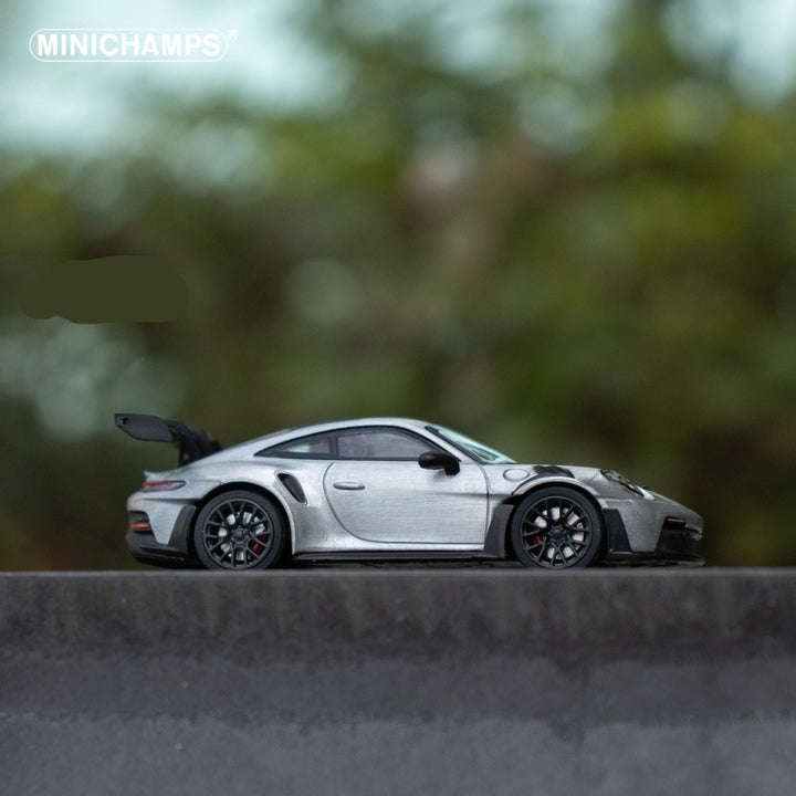 Porsche 911 GT3 RS in Raw Silver English Magazine Version 1:64 by Minichamps (MAGAZINE INCLUDED) Side View Scene