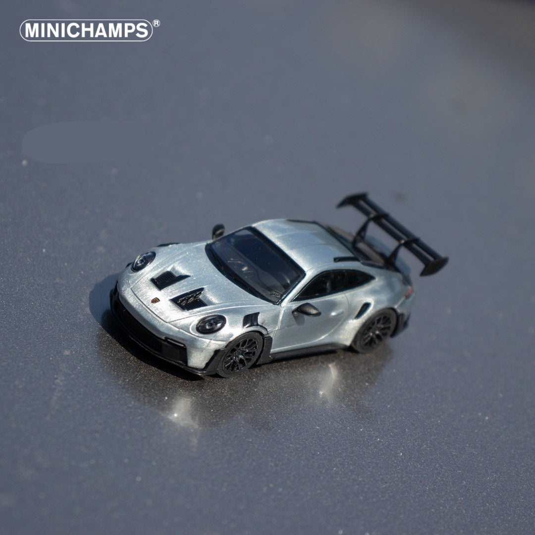 Porsche 911 GT3 RS in Raw Silver English Magazine Version 1:64 by Minichamps (MAGAZINE INCLUDED) Angled Top View