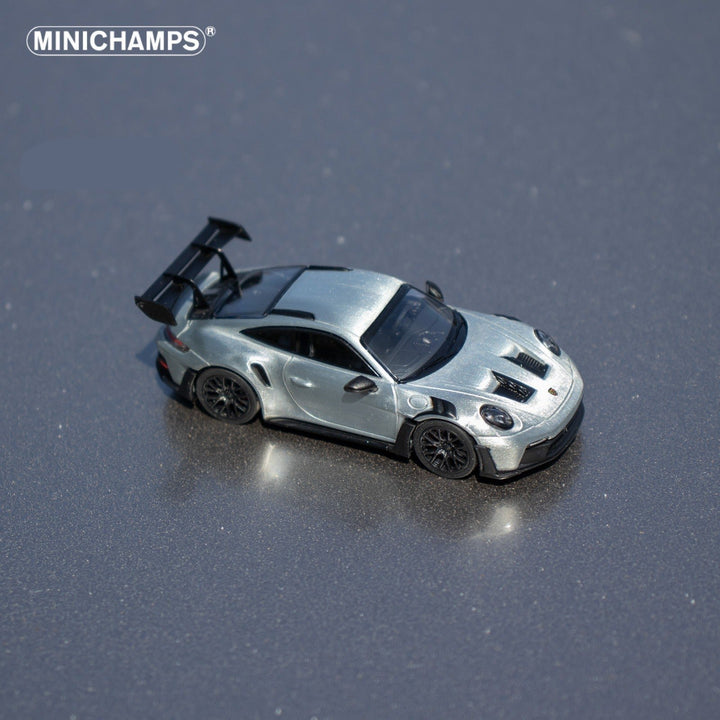 Porsche 911 GT3 RS in Raw Silver English Magazine Version 1:64 by Minichamps (MAGAZINE INCLUDED)