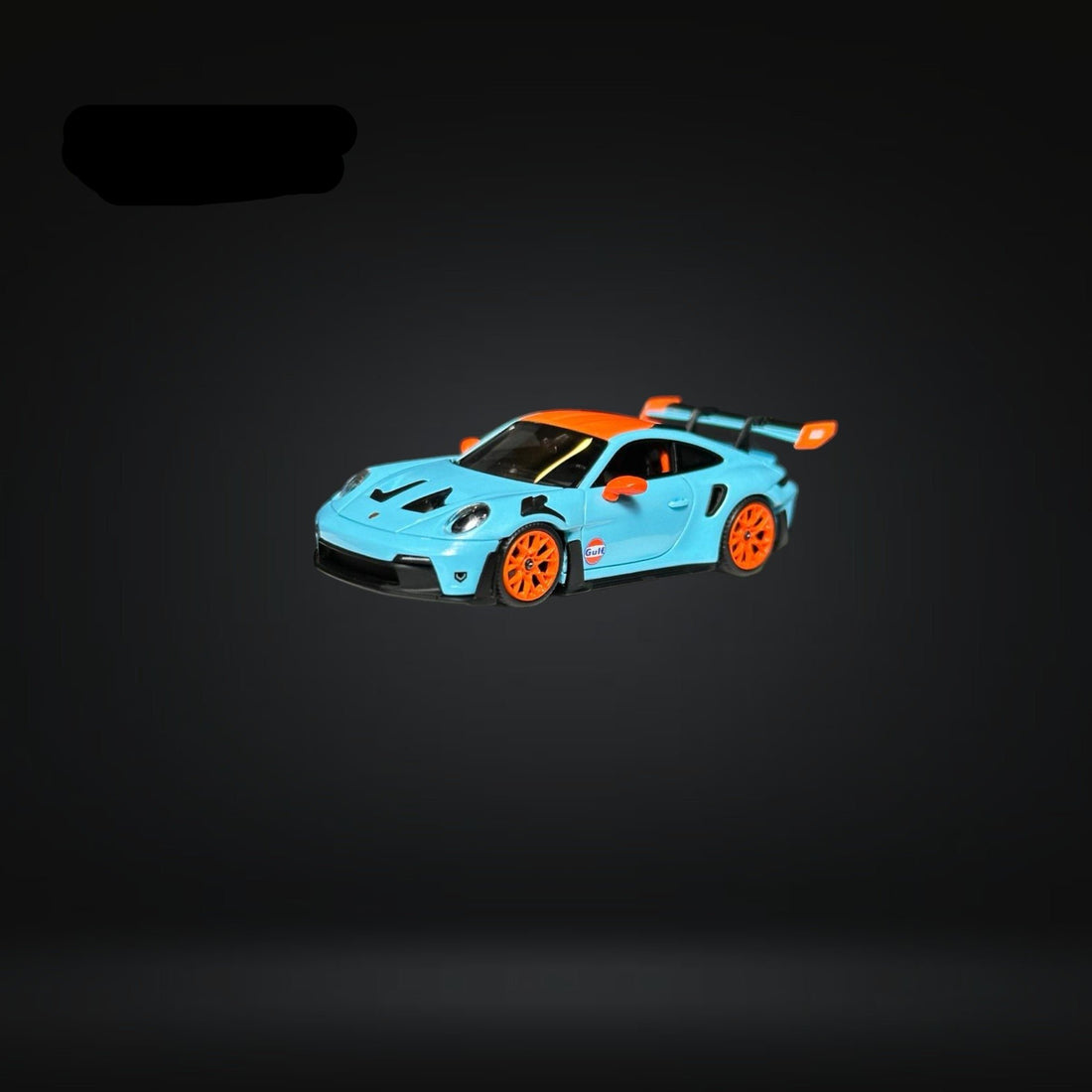 Porsche 911 (992) GT3 RS in Gulf Livery 1:64 by FuelMe Driver Side Angle View