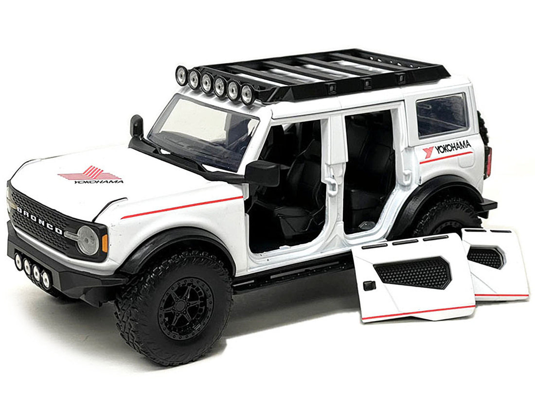 2021 Ford Bronco White with Red Stripes and Roof Rack "Yokohama Tires" "Just Trucks" Series 1/24 Diecast Model Car by Jada-1