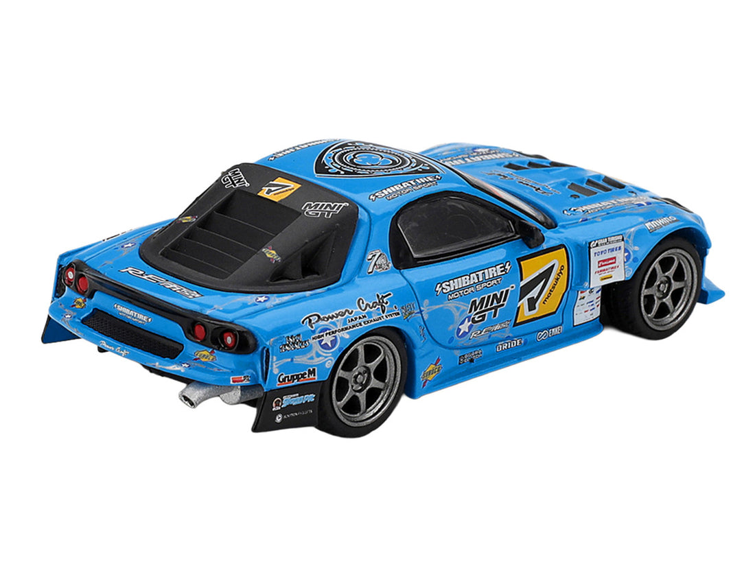 Mini GT Mazda RX-7 RE-Amemiya blue D1GP diecast rear three-quarter view