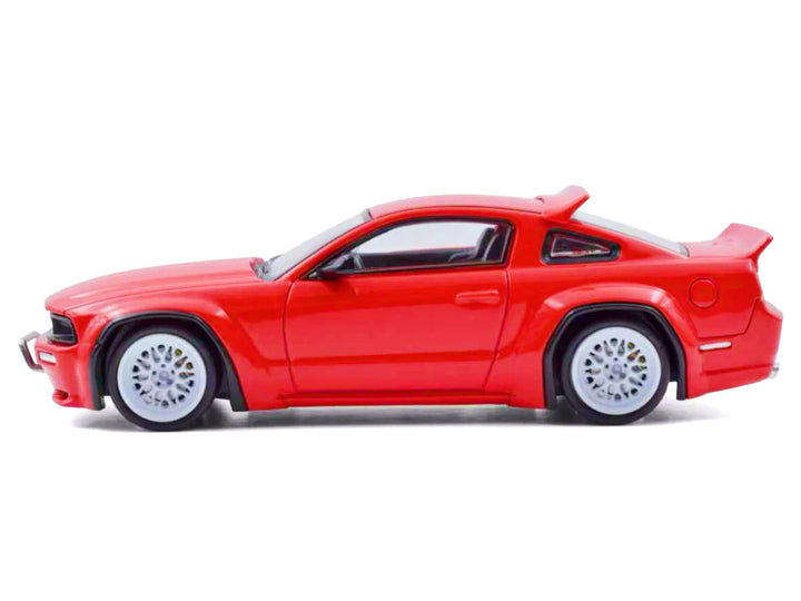 Side profile of Ford Mustang Pandem Red 1/64 diecast model showing wide-body styling.