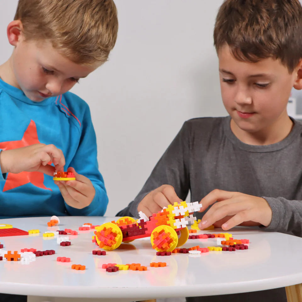 Plus Plus Tube - Color Cars - FIRE Puzzle Blocks Kids Working on a Design