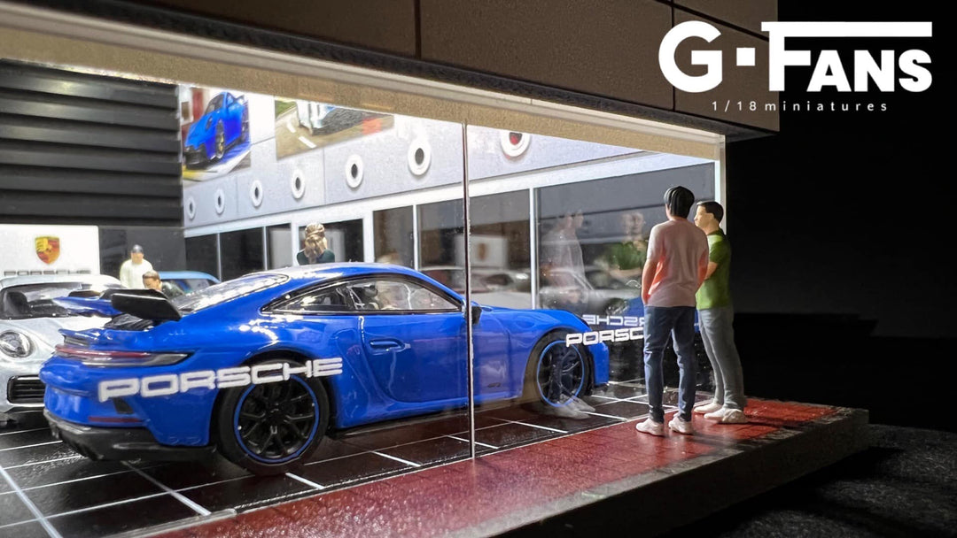 Porsche Showroom 1:64 scale Diorama by G-Fans Looking at a car
