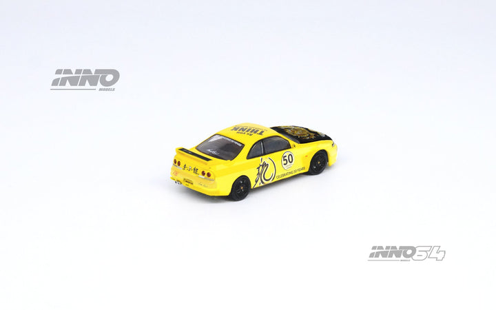 Nissan Skyline GT-R's Series Honoring Bruce Lee's 50th Anniversary 1:64 by Inno64 x TINY Yellow Angled Rear View