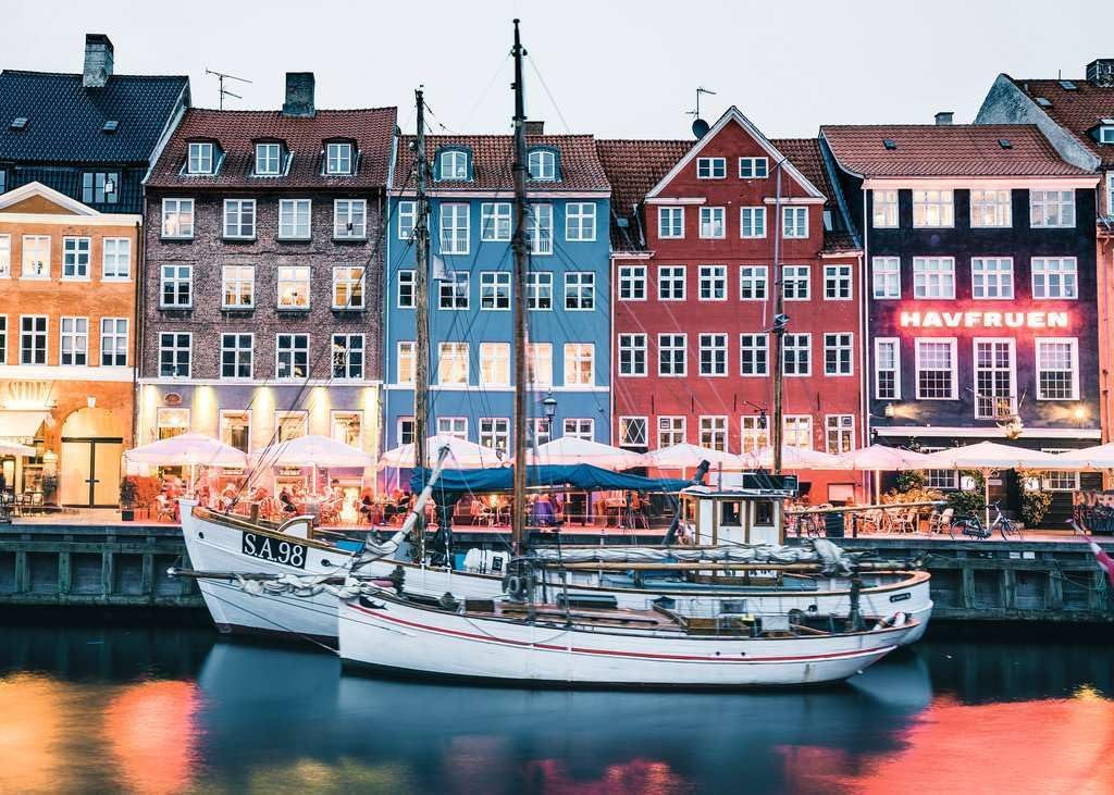 Completed Ravensburger Copenhagen puzzle showing colorful Nyhavn waterfront buildings and boats