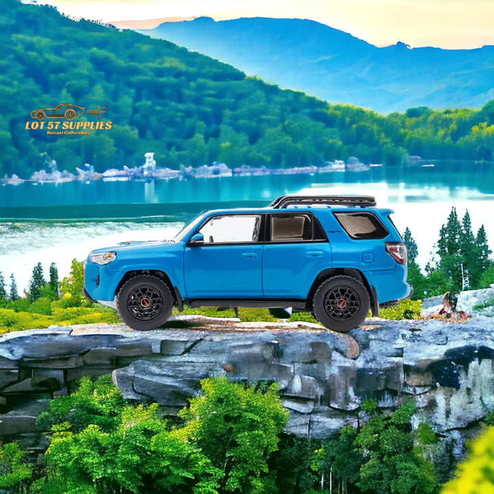 Toyota 4 Runner SUV 4x4 Off Road with Dinghy in Blue 1:64 Diecast by GCD Scenic Side View in Blue