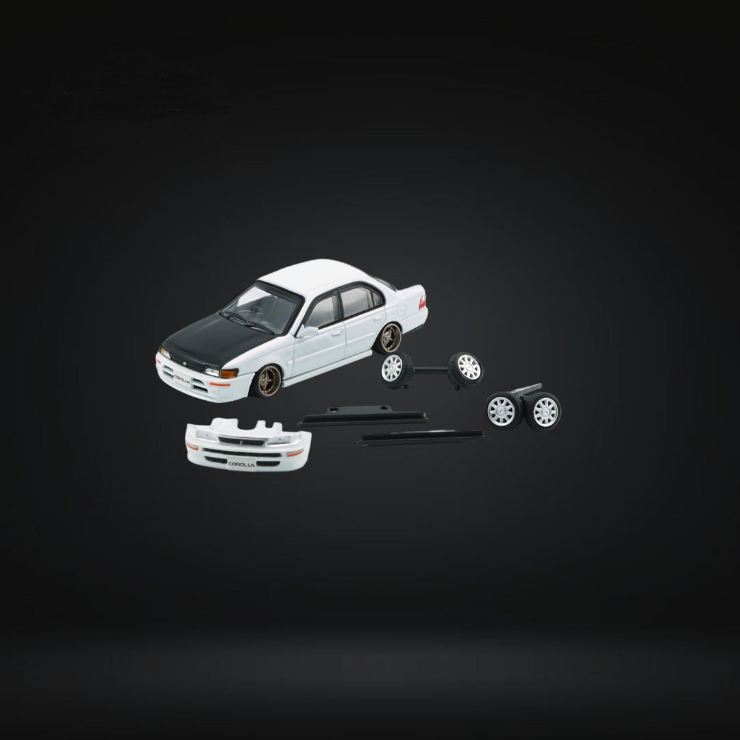 Toyota Corolla AE100 in Pearl White with Carbon Fiber Hood RHD 1:64 64B0335 Angle Front View