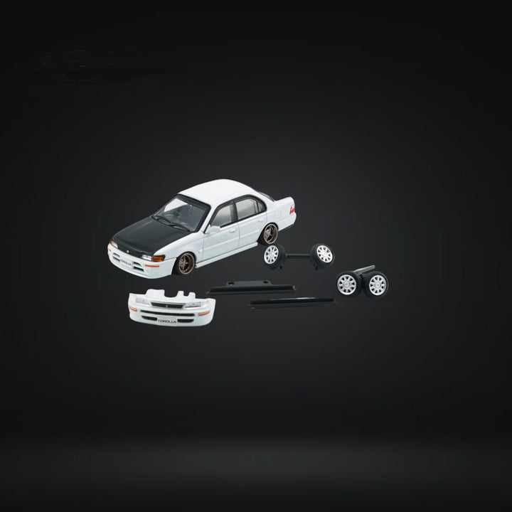 Toyota Corolla AE100 in Pearl White with Carbon Fiber Hood RHD 1:64 64B0335 Components