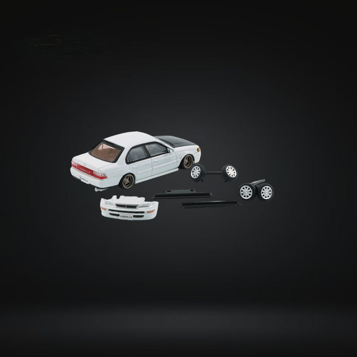 Toyota Corolla AE100 in Pearl White with Carbon Fiber Hood RHD 1:64 64B0335 Rear View