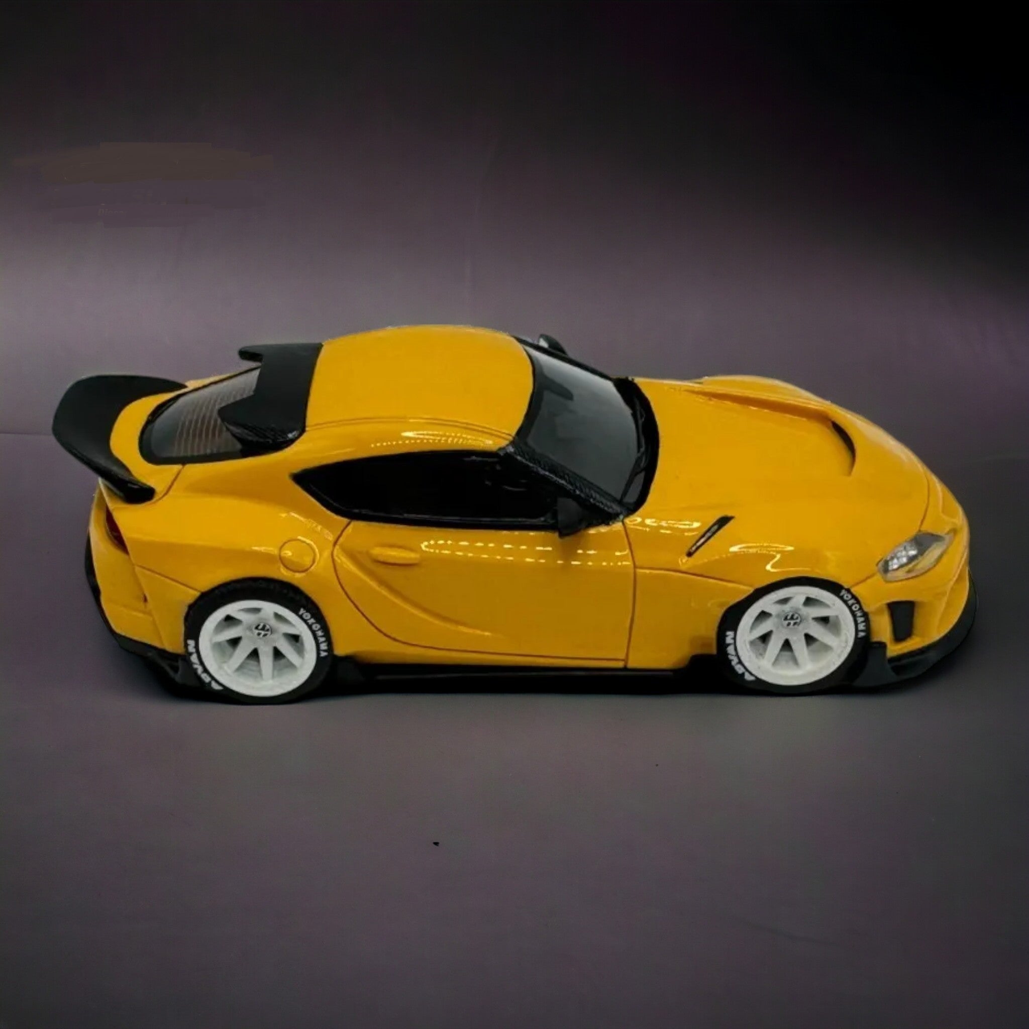 Toyota Supra GR in Yellow 1:64 Resin model by ATOZ Passenger Side View
