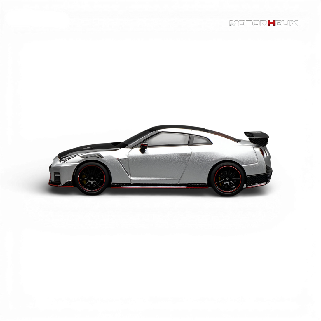 Side profile of the MotorHelix Nissan GT-R NISMO (R35) Special Edition 2022 in Ultimate Metal Silver showcasing the aerodynamic body lines and NISMO styling.