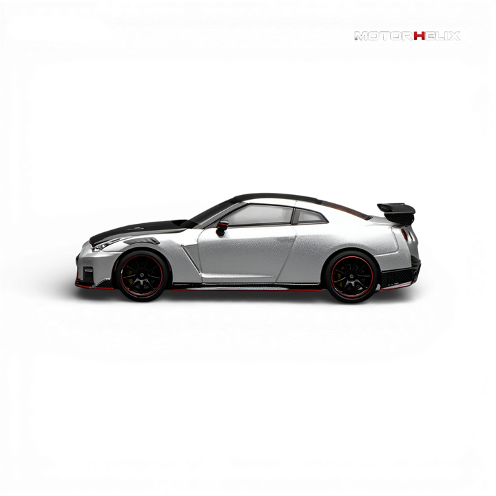 Side profile of the MotorHelix Nissan GT-R NISMO (R35) Special Edition 2022 in Ultimate Metal Silver showcasing the aerodynamic body lines and NISMO styling.