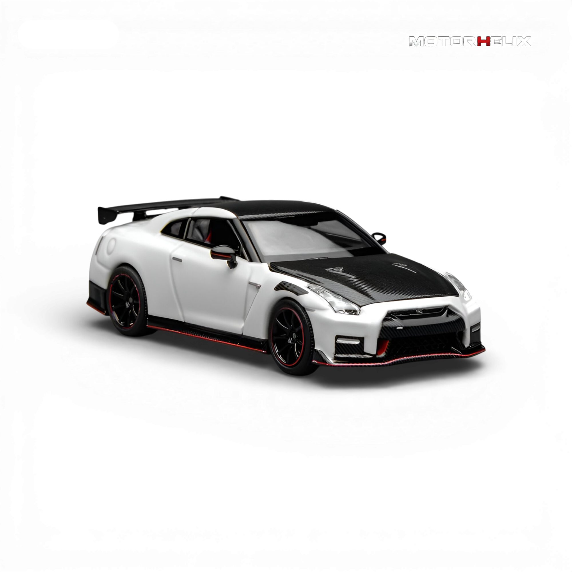 Front three-quarter view of the MotorHelix Nissan GT-R NISMO (R35) Special Edition 2022 1:64 diecast model finished in Brilliant White Pearl.