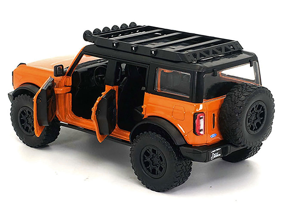 2021 Ford Bronco Orange with Black Stripes and Roof Rack "Just Trucks" Series 1/24 Diecast Model Car by Jada-1