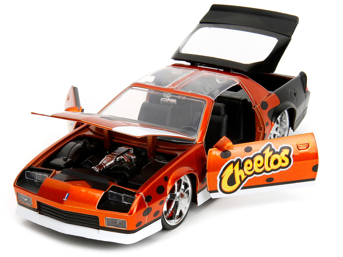 1985 Chevrolet Camaro Z/28 Orange Metallic with Graphics and Chester Cheetah Diecast Figure "Cheetos" "Hollywood Rides" Series 1/24 Diecast Model Car by Jada-1