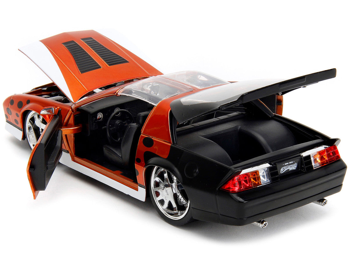 1985 Chevrolet Camaro Z/28 Orange Metallic with Graphics and Chester Cheetah Diecast Figure "Cheetos" "Hollywood Rides" Series 1/24 Diecast Model Car by Jada-3