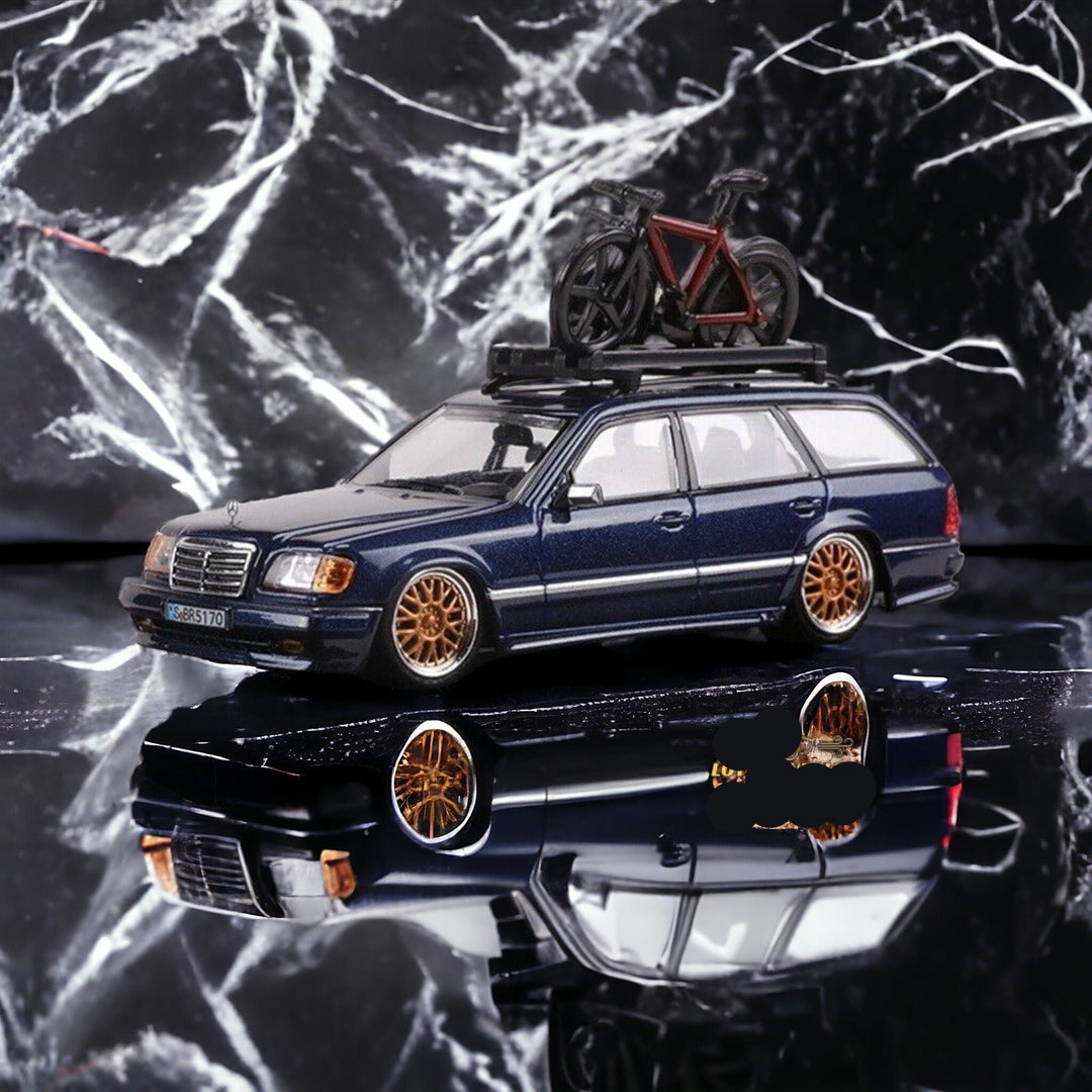 Mercedes-Benz Wagon Version S124 SILVER / BLUE 1:64 by Mortal Angled Side View