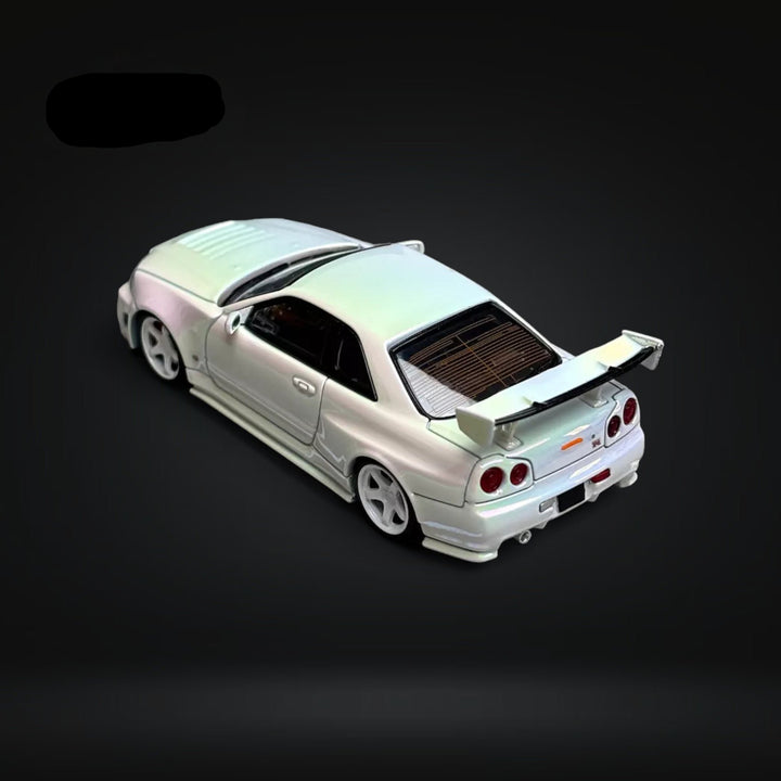 Skyline GT-R R34 Nismo Z-Tune High Wing White Pearl 1:64 by Fuji Rear Left Angle View