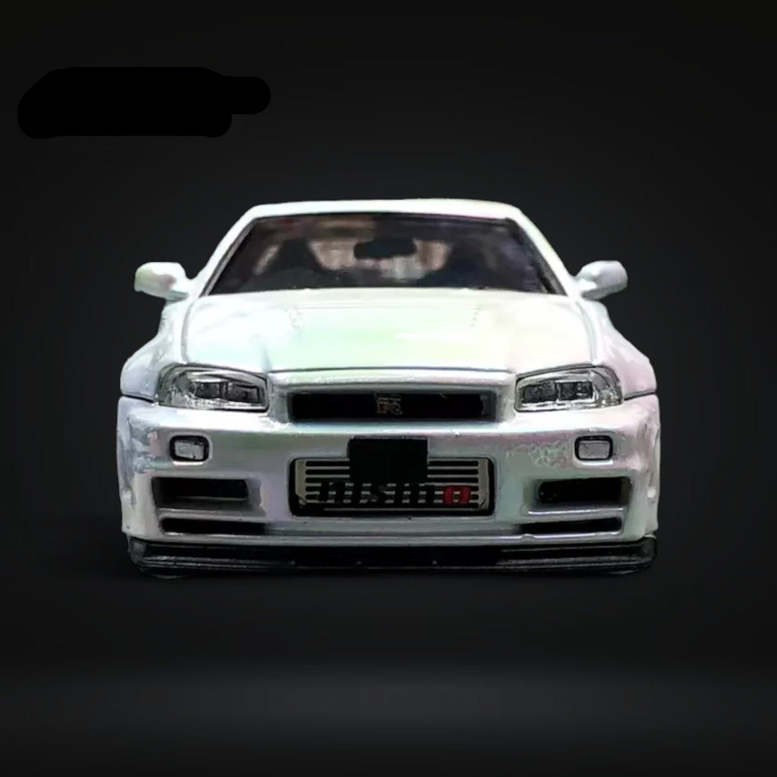 Skyline GT-R R34 Nismo Z-Tune High Wing White Pearl 1:64 by Fuji Front View