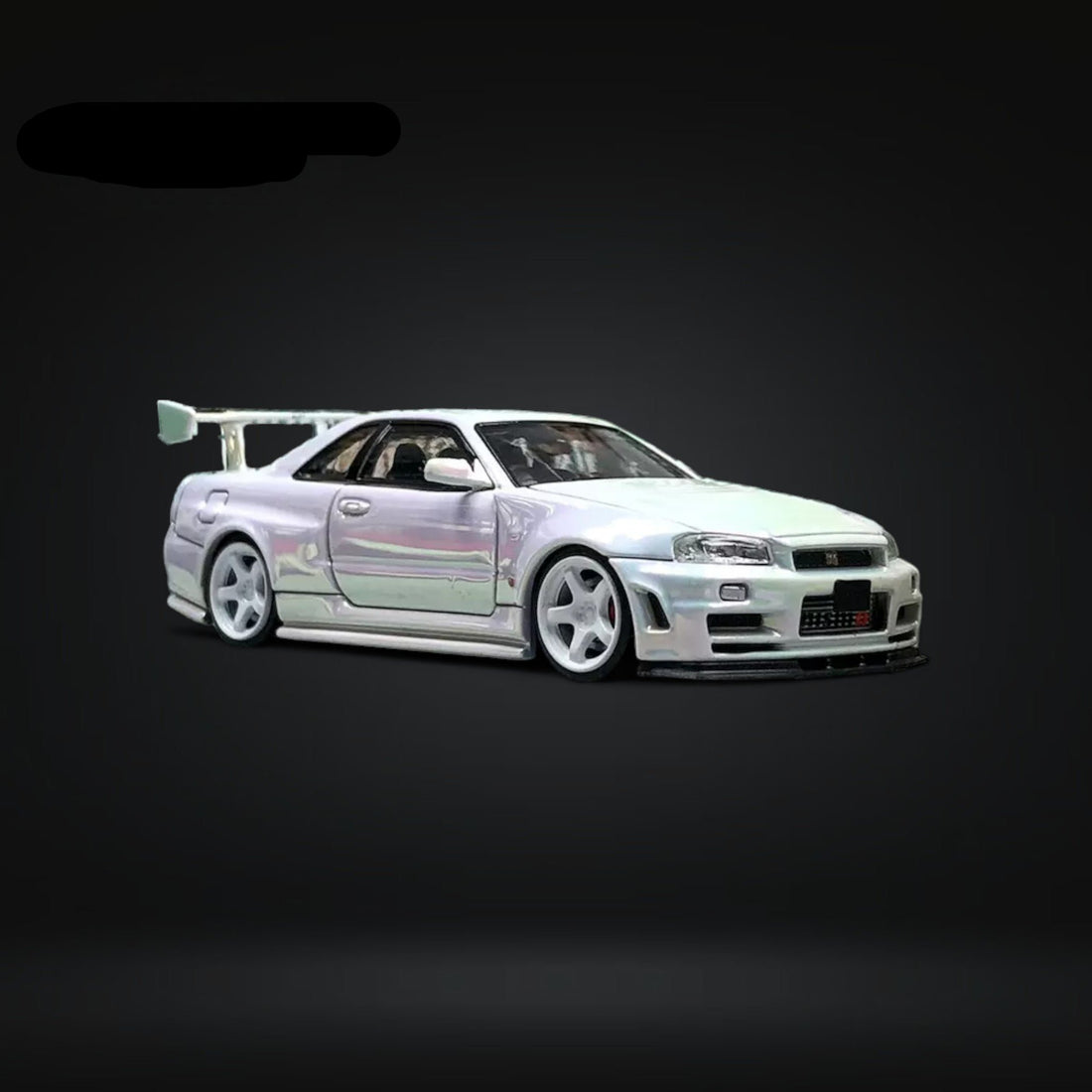 Skyline GT-R R34 Nismo Z-Tune High Wing White Pearl 1:64 by Fuji Front Angle View