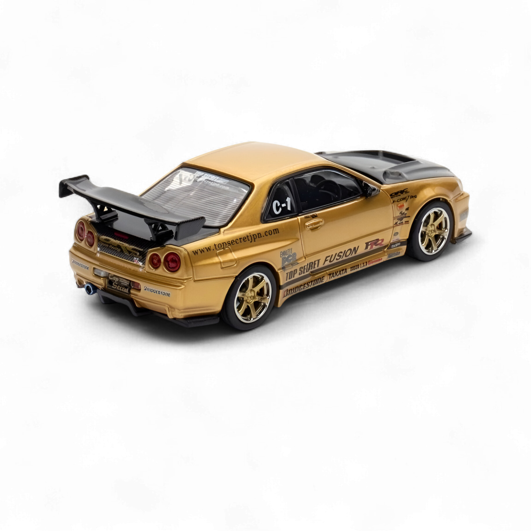 Nissan Skyline TOP SECRET R34 GT-R - Gold 1:64 by Inno64 2