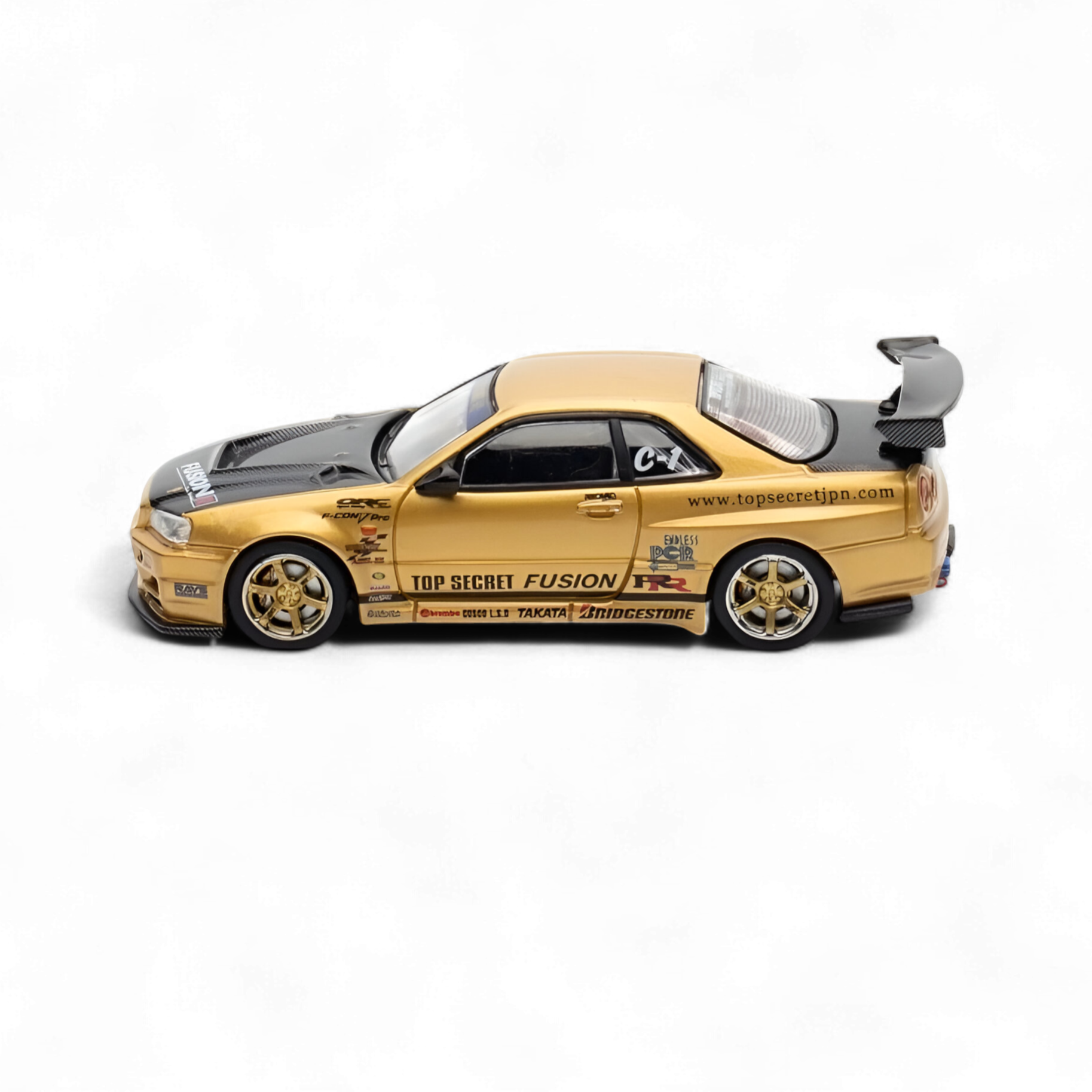 Nissan Skyline TOP SECRET R34 GT-R - Gold 1:64 by Inno64 3